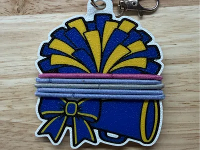 Cheer hair tie holder keychain with megaphone and pom poms in blue and yellow