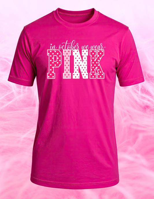 Hot pink In October We Wear Pink breast cancer awareness T-shirt with polka-dot varsity lettering
