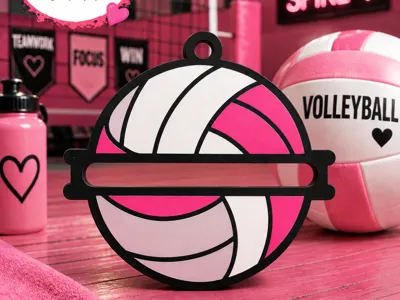 Pink and white volleyball-shaped hair tie holder holding a hair tie
